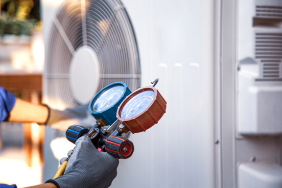 A team member from R.D. Davis performs HVAC system service as part of their works as a HVAC Contractors Chatham IL residents choose
